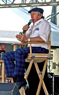 Jackie Stewart speaking.jpg